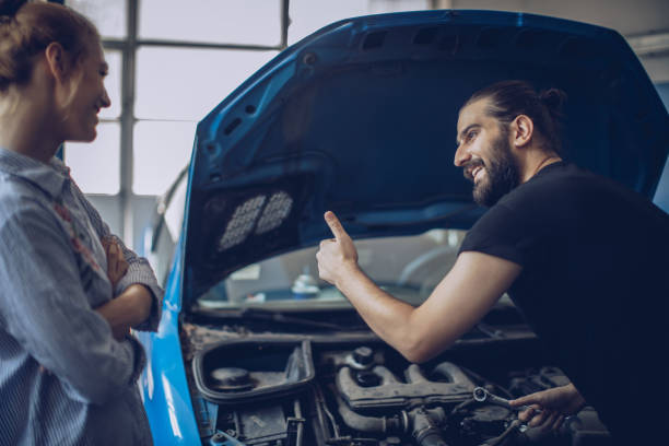 a man and a woman are smile auto repair